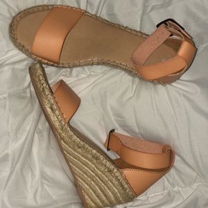 Opened toe orange wedge like sandals